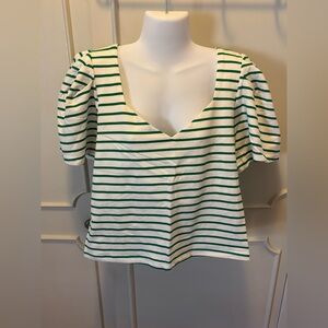 Skies are blue green, and white striped top.